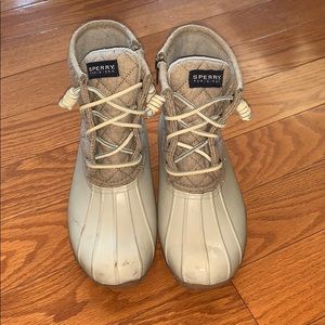 White and tan Sperry rain boots